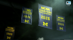 The U-M Men's Basketball 2026 National Championship banner is raised in Crisler Arena on April 11, 2026.