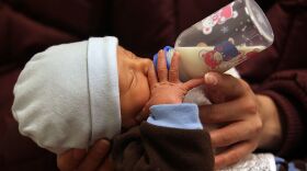 A baby drinks from a bottle during a newborn care class. Congenital syphilis rates have been rising, and the only U.S.-made drug that can be used for pregnant women and babies with the infection, an injectable antibiotic, has been in shortage. (Photo by John Moore/Getty Images)