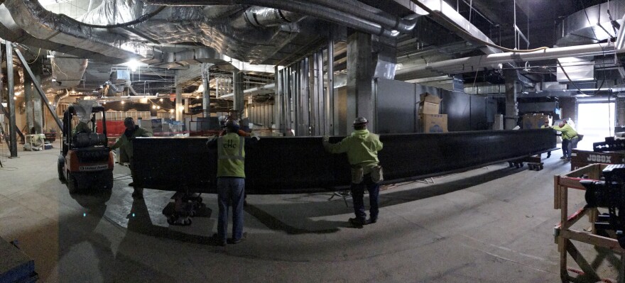 Eight 12,000-pound steel beams were lifted into place from below rather than lowered from above. The beams were installed above the Children's Museum to help support the front plaza and driveway. The originals were compromised by 84 years of water damage.