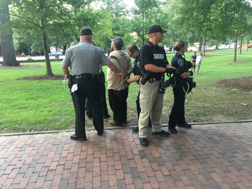 Police arrest one person during the protests against the Silent Sam statue on the campus of the University of North Carolina in Chapel Hill on Tuesday, August 22, 2017.