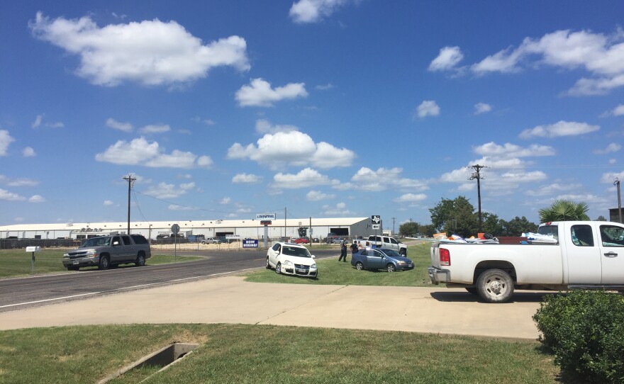 Cars blocked access to the parking lots of Load Trail in Sumner during Tuesday's Immigration and Customs Enforcement raid.