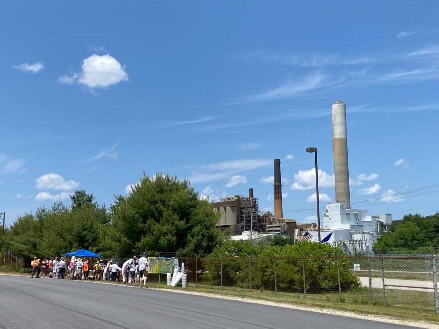 Advocates gathered outside of the Merrimack Station in Bow, NH to call for the coal plant's retirement