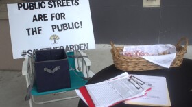 Save the Garden volunteers set up shop outside East Community Library in Clearwater last Saturday afternoon. They said Friday morning's near-torrential downpours didn't stop 35 residents from signing their petitions in the first hour.