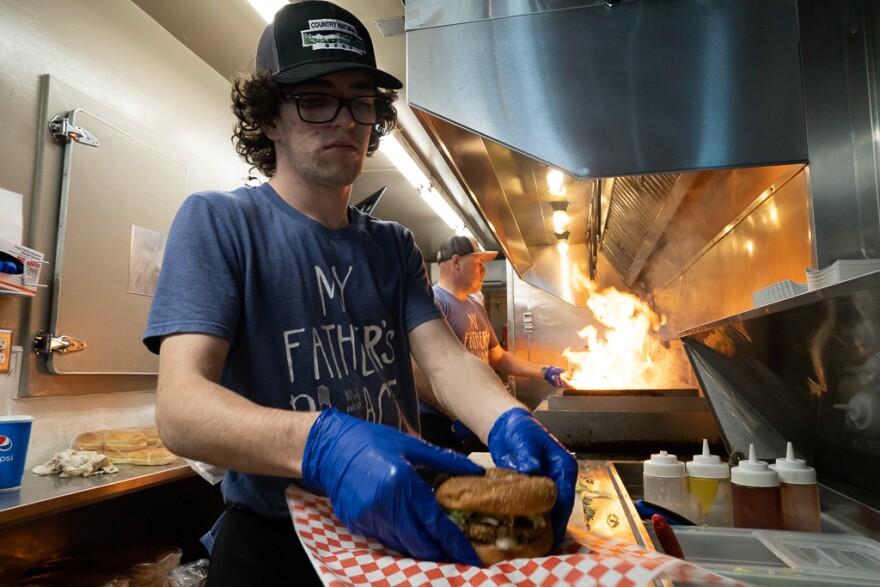 A cook works on order at My Father's Place in McCall. The business is a family-owned local restaurant near Payette Lake that's been around for decades. They serve burgers, fries, shakes and more.