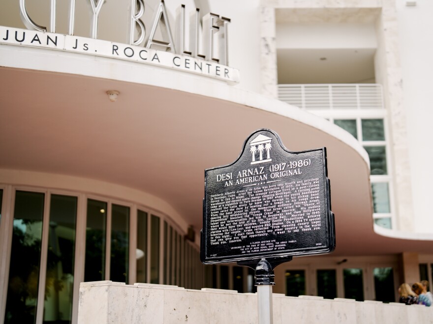 A historical marker in front a nightclub 
