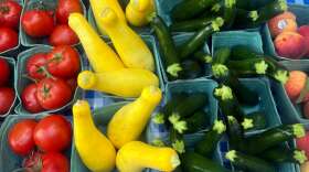 A mix of produce, including squash, tomatoes, zucchini and peaches