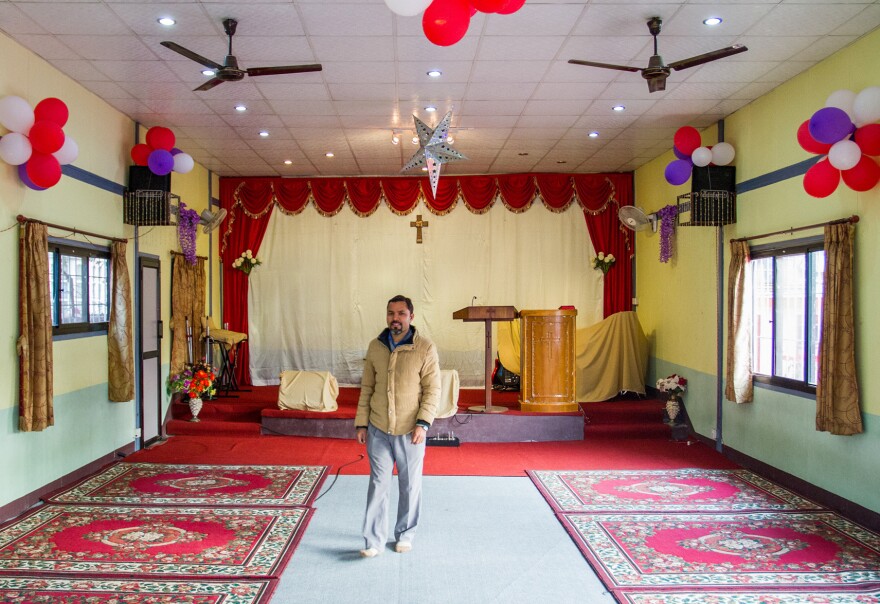 Tej Rokka is a Nepali pastor who works with the evangelical group Climbing for Christ. He's standing inside Savior Alone Redeems Asians church, in Kathmandu, where he preaches.