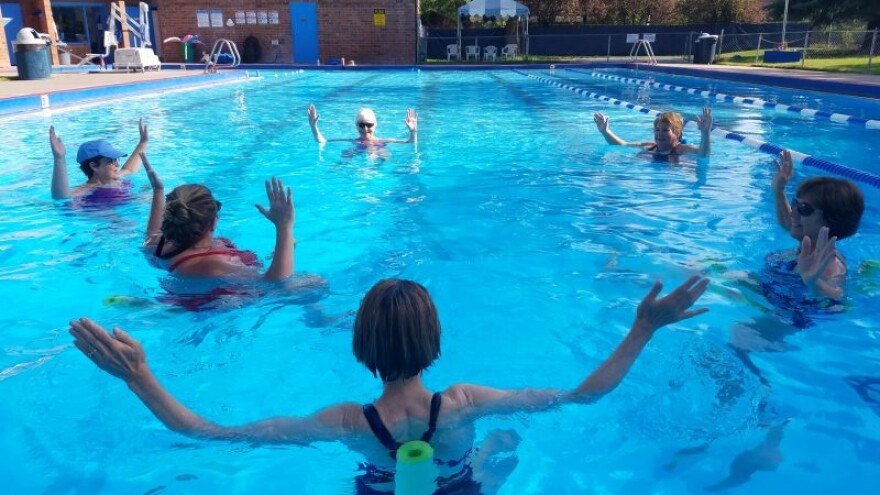 "All in favor ... raise both hands!" Residents enjoy a water aerobics class at the John M. Fleet Pool in Carbondale. Voters approved the construction of a new aquatics center to replace the over 40-year-old facility.