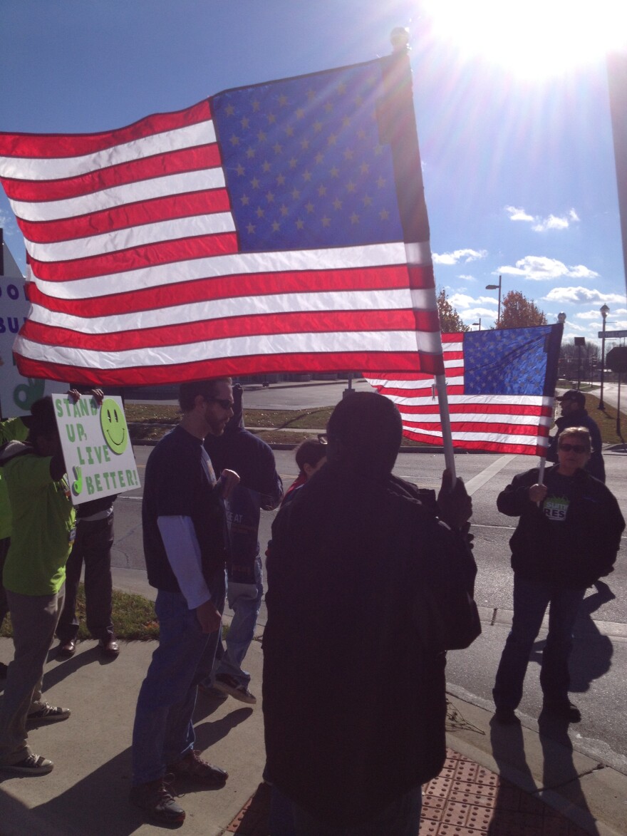 Workers march to deliver "strike papers" to Walmart officials. Nov 2013