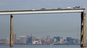 People work on a standing section of the collapsed Francis Scott Key Bridge, Monday, April 15, 2024, in Baltimore. The FBI confirmed that agents were aboard the Dali conducting court-authorized law enforcement activity. (AP Photo/Julia Nikhinson)