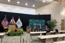 Four panelists sit in an auditorium at USF to debate the prospect of eliminating property taxes in Florida 