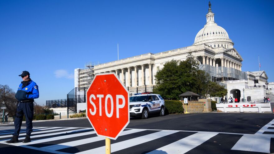 A police officer stands near the U.S. Capitol during a partial government shutdown in Washington, D.C., on Thursday.
