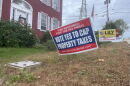 A sign outside of the office of the New Hampshire Republican Party in Concord urging voters to vote "yes" on a school tax cap ballot question this fall.