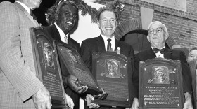 Hall of Famers, from left, Edd Roush, Jackie Robinson, Bob Feller and Bill McKechnie, hold the plaques presented to them in Cooperstown, N.Y., on July 23, 1962.
