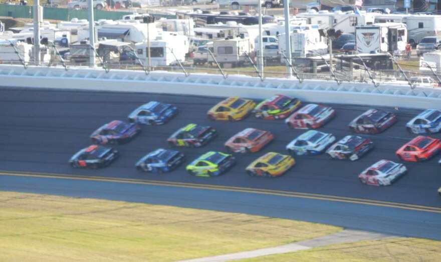 Denny Hamlin leads in the Daytona 500, 2015. Photo by Nascarking, via Wikimedia Commons. 