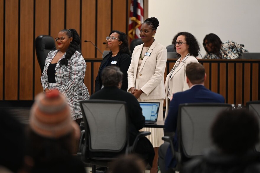 School board members vote on important issues affecting their school districts, including the hiring of a superintendent, and the district budget. Pictured above from left to right are Ashley Thomas, Indianapolis Public Schools commissioner for District 1; Deandra Thompson, IPS commissioner at large; Allissa Impink, IPS commissioner for District 4; and former commissioner Gayle Cosby.