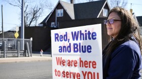 Department of Veterans Affairs registered nurse Renee Luneau-Sheckfee stands outside the West Haven VA Medical Center holding a sign in support of her fellow employees on March 3, 2025. According to Luneau-Sheckfee recent communication from the federal government indicating potential job cuts at the VA is an attempt at pressuring employees to quit. She said she will refuse to.