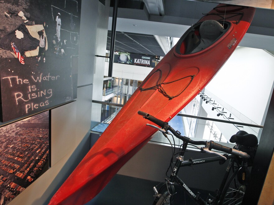 A kayak used by <em>Times-Picayune</em> photographer John McCusker to cover Hurricane Katrina is displayed at the Newseum in Washington, D.C., in 2010. McCusker, who worked for the paper for 25 years, is being laid off.