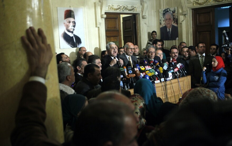 In this Monday, Jan. 28, 2013 file photo, former Egyptian presidential candidate, Hamdeen Sabahi, center left, and former Egyptian foreign minister and Nobel laureate Mohamed ElBaradei, right, speak during a press conference held by Egyptian opposition leaders.