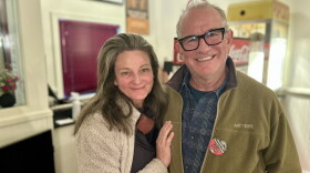 Carbondale residents Helen Copping and Martin Evans pose in front of the concession stand inside the Crystal Theatre after an information session about the statewide ballot measures on Oct. 21, 2026.