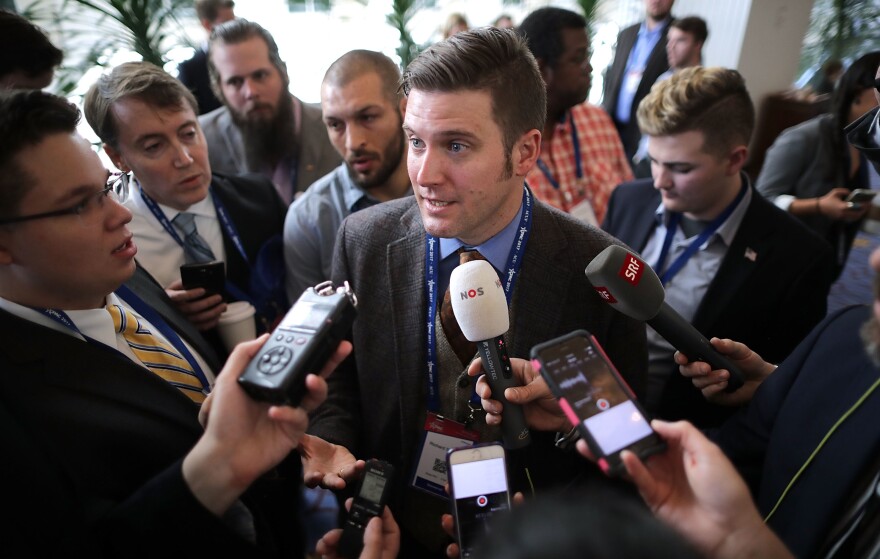 Reporters surround white nationalist Richard Spencer on Thursday at the Conservative Political Action Conference in National Harbor, Md.