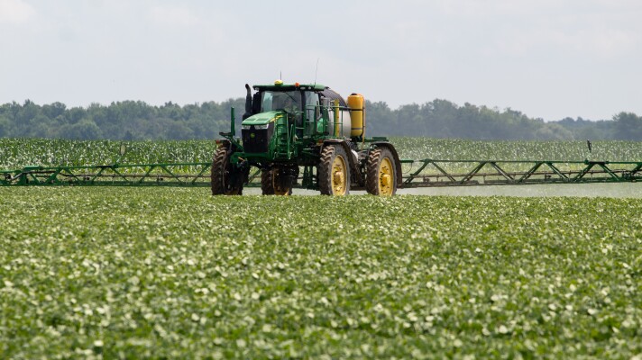 A John Deere tractor fertilizing a field of dry black beans at the Stoutenburg family farm in Sandusky, Michigan. Manufacturers of farm equipment, including John Deere, argue that allowing farmers and independent mechanics to fix equipment could jeopardize intellectual property.