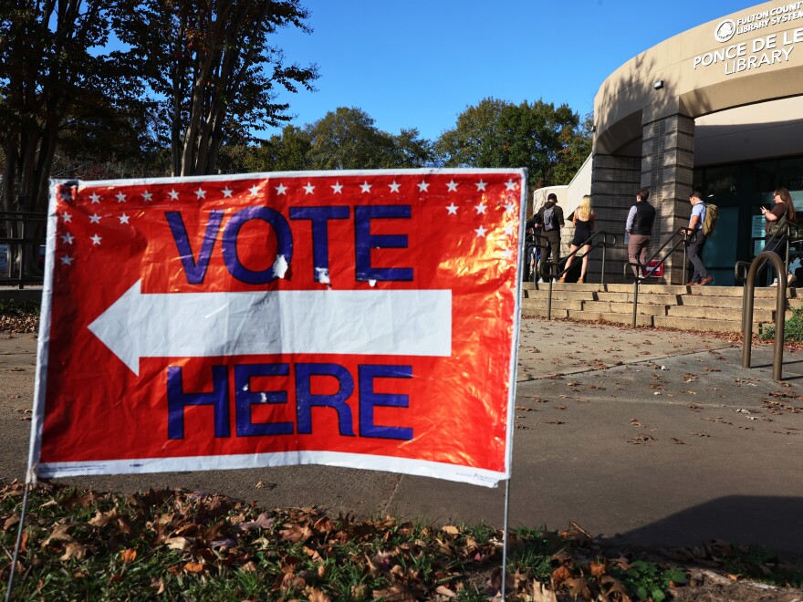 People wait in line for early voting for the midterm elections at Ponce De Leon Library on Nov. 4 in Atlanta, Georgia.