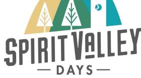 Logo for Spirit Valley Days; tri-colored illustration of pine trees and a clock tower