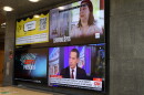 Several news feeds are displayed at the Alder Journalism building on the University of Iowa campus.