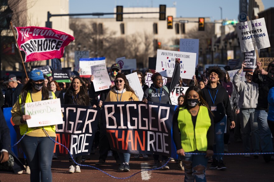 People march through downtown Amarillo to protest a lawsuit to ban the abortion drug mifepristone Saturday, Feb. 11, 2023, in Amarillo, Texas. Some Democrat-controlled states are advancing and adopting laws and executive orders intended to shield their residents against civil lawsuits and criminal investigations related to providing abortions for women from states where there are bans.