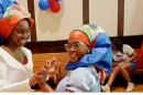 Two Haitian Ohioans celebrating Flag Day in Springfield last year. The city's robust Haitian population has been shaken by last week's Supreme Court decision.