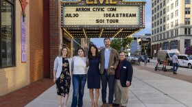 A photo of the "Sound of Ideas" team in front of the marquee of the Akron Civic Theater