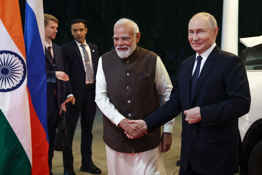 Russian President Vladimir Putin, right, and Indian Prime Minister Narendra Modi arrive at the Indian Prime Minister office in New Delhi, India, Thursday, Dec. 4, 2025. (Alexander Kazakov, Sputnik, Kremlin Pool Photo via AP)