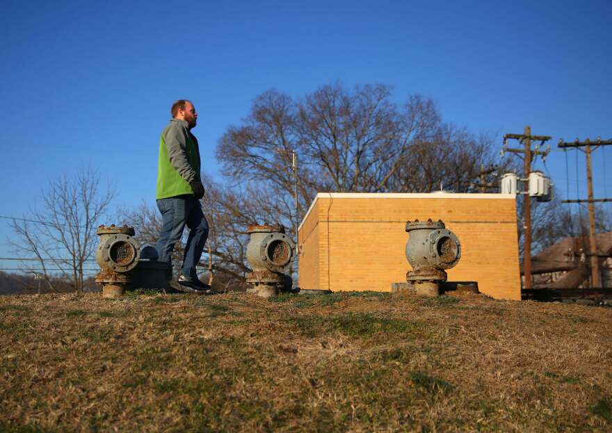 Jeremy Shannon, from Southgate, Kentucky, walks near the Licking River Greenway and Trails next to the Licking River in Covington, Kentucky. The trail is across the river from IPSCO Tubulars in Wilder, Kentucky. According to public records, the facility had four Clean Water Act violations in the last six quarters