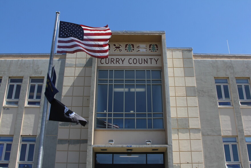 The Curry County Administrative Annex building, with American flag flying in front of the building and "Curry County" displayed above the entrance.