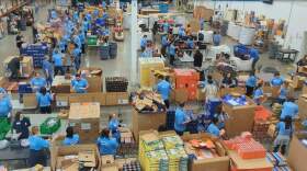 Volunteers working at the Northern Illinois Food Bank. To date, it's brought in 400,000 more pounds of food because of a federal program that connects farms with food pantries in an effort to cut down on food waste. (Courtesy of Northern Illinois Food Bank)