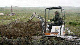 In this file photo, a worker with the Pebble Mine project test drills in the Bristol Bay region of Alaska.