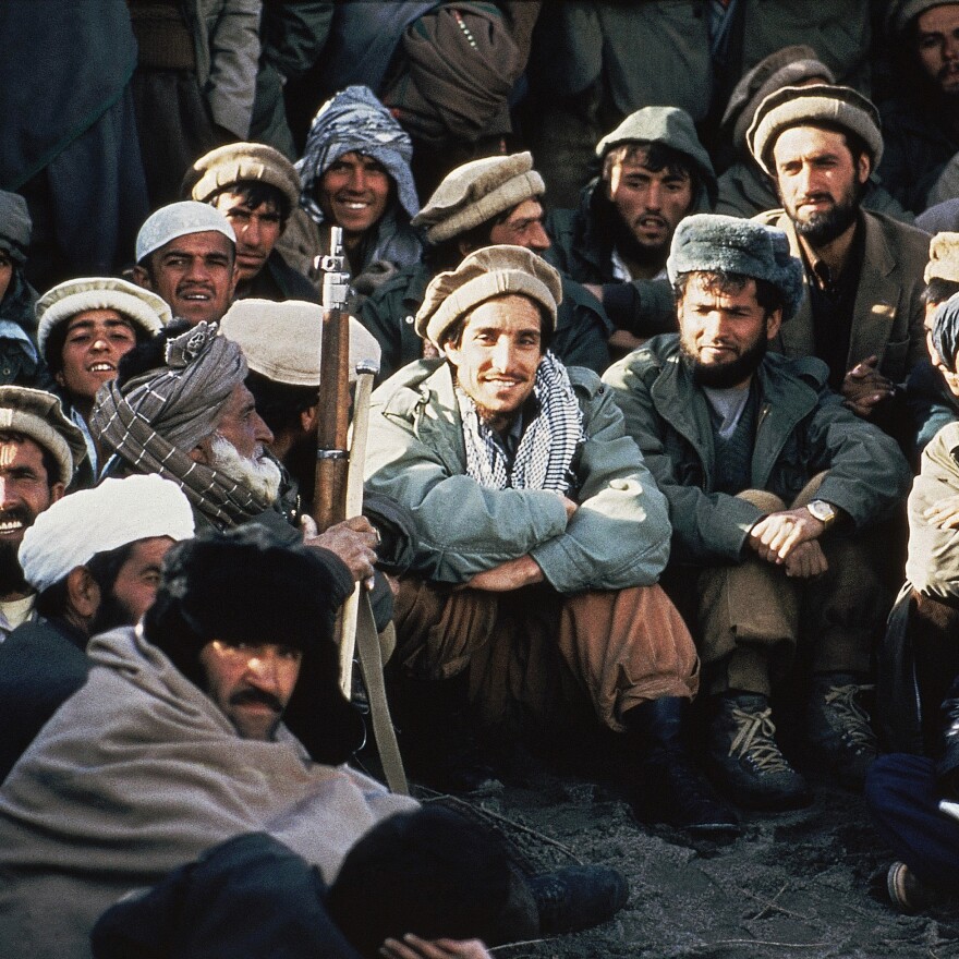 Afghan guerrilla leader, Ahmad Shah Massoud, center, is surrounded by rebel commanders at a meeting in the Panjshir Valley in northeast Afghanistan, in 1984.