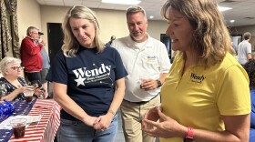 Democrat Wendy Dant Chesser talks with supporters at a watch party in Clark County on election night.