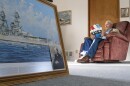 Pearl Harbor survivor and World War II Navy veteran David Russell, 101, reads a birthday card while talking about his time aboard USS Oklahoma and his life after the war on Monday, Nov. 22, 2021, in Albany, Ore. (AP Photo/Nathan Howard)