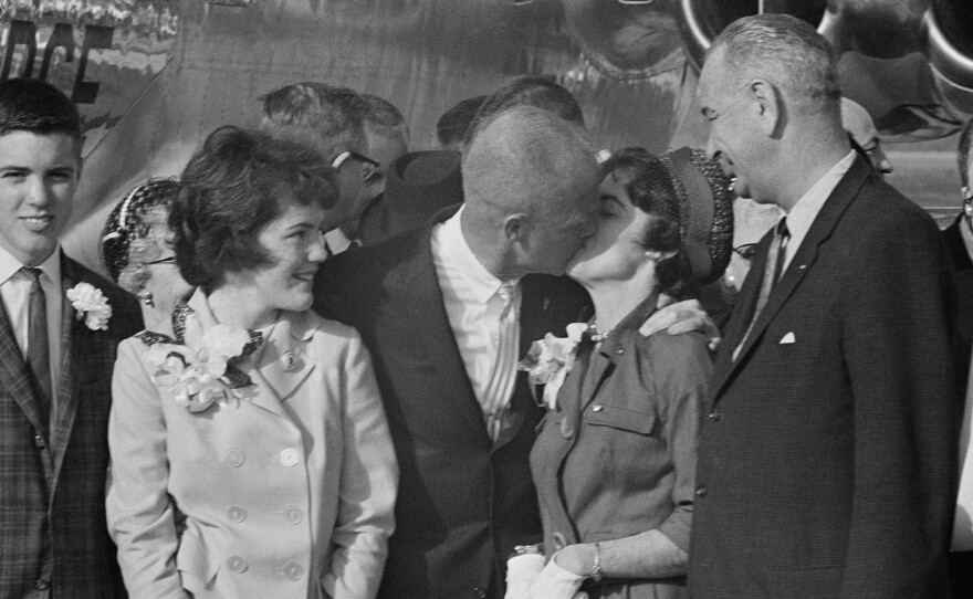 Glenn kisses his wife, Annie, after their post-spaceflight reunion at Patrick Air Force Base, Fla. To their left are their daughter and son, Lyn and David.