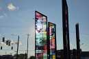 Stained glass panels of photos and newspaper headlines of Martin Luther King Jr.