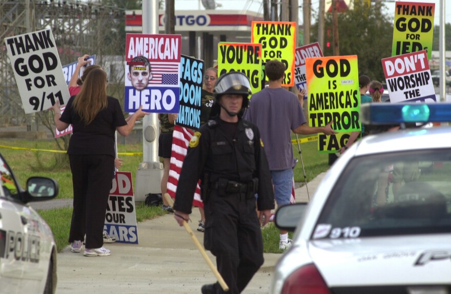 Westboro Baptist Church founder Fred Phelps is reportedly in hospice care in Topeka, Kan. Members of the church protest outside the gates at Fort Campbell, Ky., in this 2006 photo.
