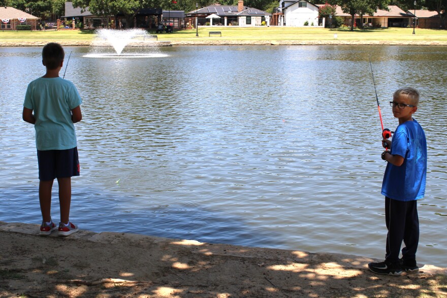 Young anglers Quinn and Liam Murphy cast their lines at Boys Ranch Lake. July 2, 2026. 