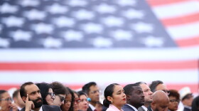 Attendees listen to the names of Fire Department of New York, FDNY, members killed during the 9/11 attacks at a memorial to commemorate the 25th anniversary of 9/11, Wednesday, Sept. 9, 2026, in the Staten Island borough of New York. (AP Photo/Pamela Smith)