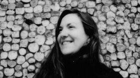 black and white photo of a woman smiling