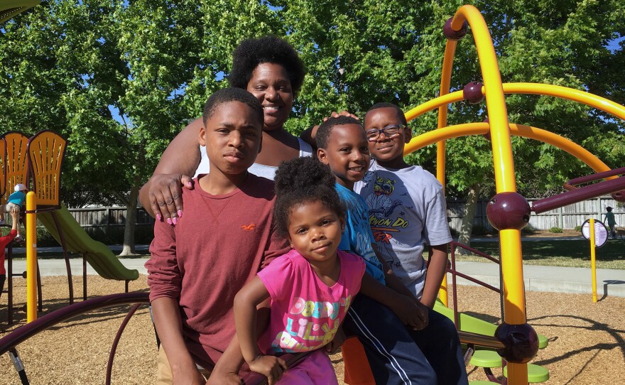 Zunika Crenshaw packs her purse full of asthma and allergy medications for her children when they go to the park near their house in Pleasanton, Calif.