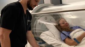 Long COVID patient Mia Hamza relaxes inside a hyperbaric oxygen chamber