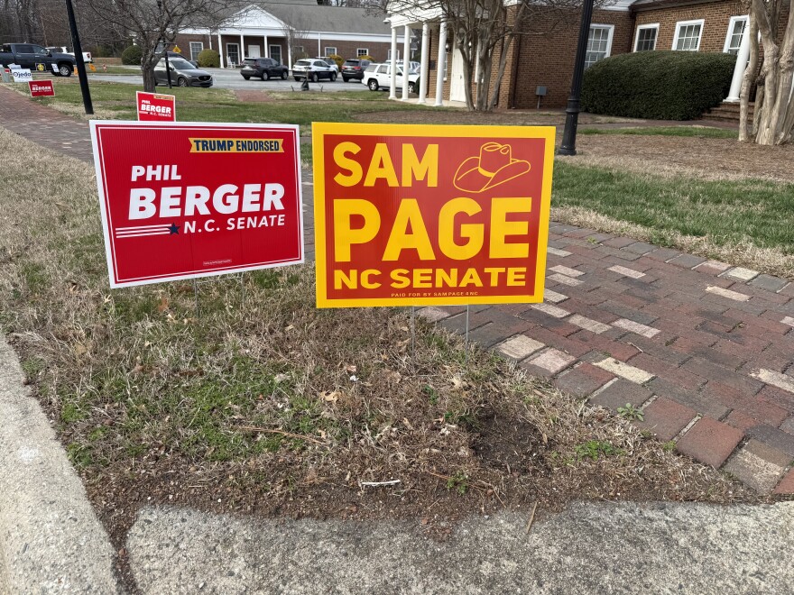 Sheriff Sam Page leads Phil Berger by two votes in N.C. Senate District 26 after election day ballots were tallied. This photo shows campaign signs for the two candidates outside of a polling place in Jamestown on Tuesday, March 3.