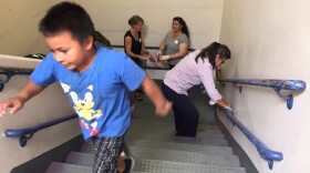 Families at Rainier Prep, a charter school, at a work party last summer.